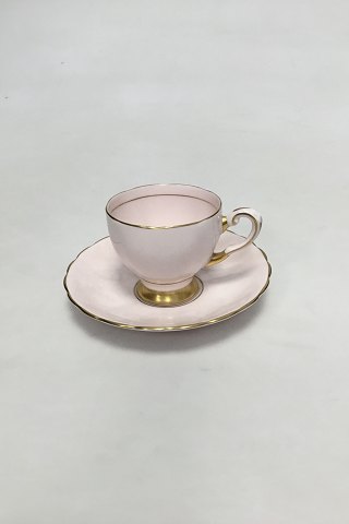English, R H & S L Plant (Ltd) pink porcelain cup and saucer with gilt rim.