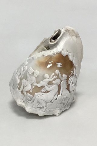 Cameo carved conch with classic motives.